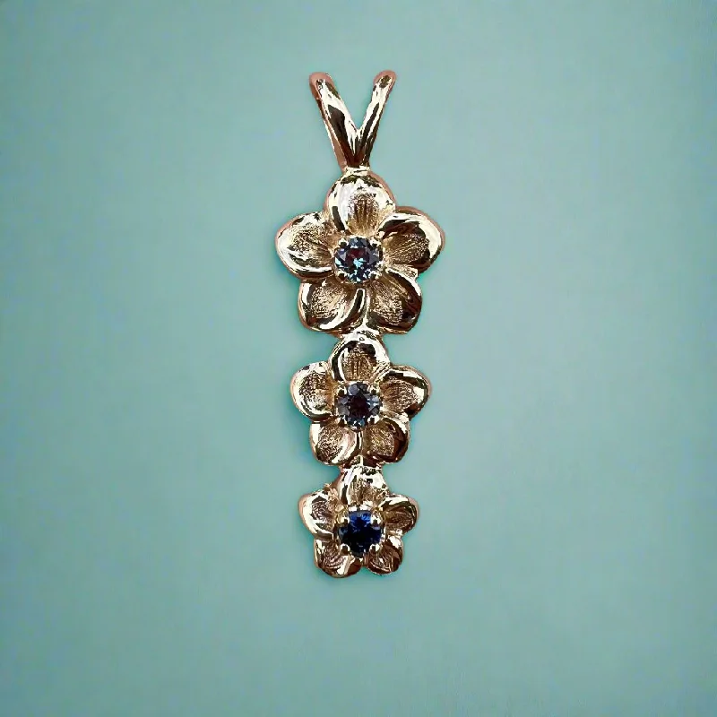 Three Vertical Plumeria Pendant w/ Blue Sapphire and two Alexandrites in 14K Yellow Gold