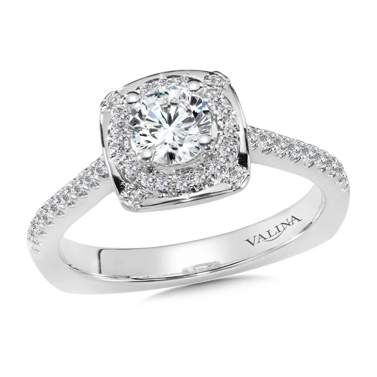 Diamond halo engagement ring mounting with side stones set in 14k white gold.